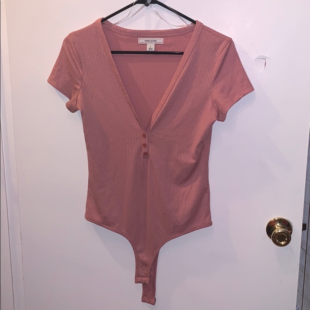 Peach colored body suit